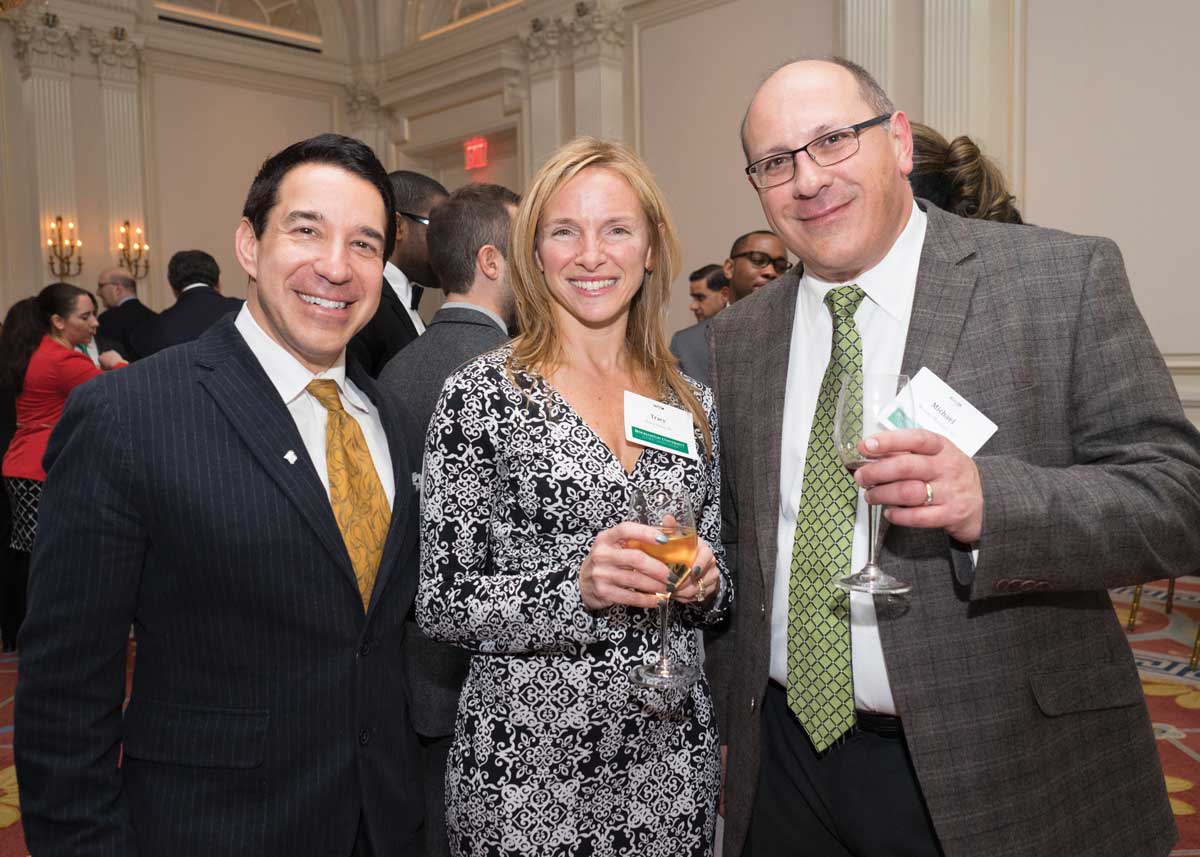 From left: Keith Hurd '88, Tracy Freno '91 and Michael Marzano '83 attend a Metro New York volunteer reception in 2016.