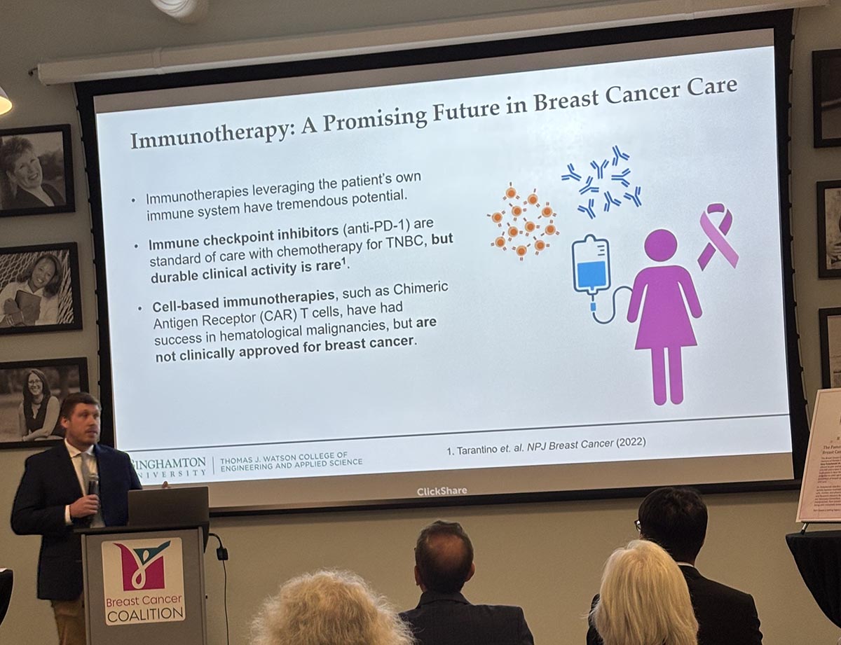 Assistant Professor Daniel S. Reynolds presents his research to the Breast Cancer Coalition in Rochester earlier this month.