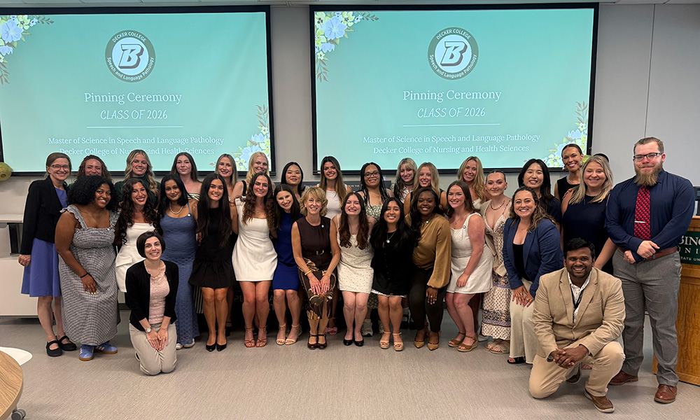 The members of the MS-SLP Class of 2026 and SLP faculty at the pinning ceremony on June 26.
