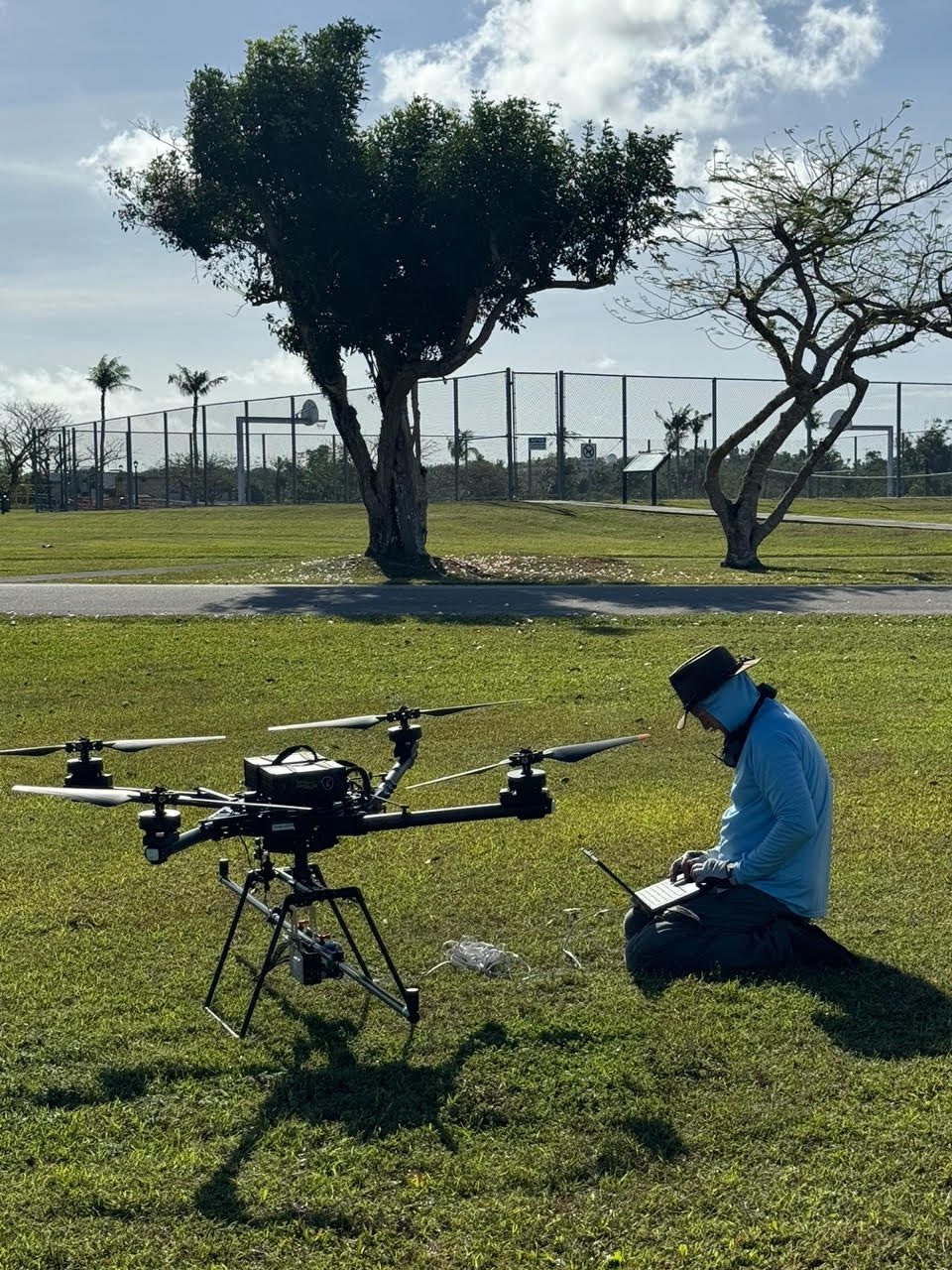 Associate Professor of Geography Thomas Pingel programs a research drone in Guam.
