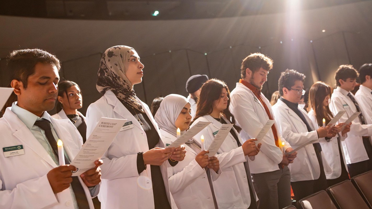 The School of Pharmacy and Pharmaceutical Sciences Class of 2029 participated in its White Coat Ceremony, Aug. 23, in the Anderson Center's Osterhout Concert Theater. Here, students prepare to recite the Oath of a Pharmacist.