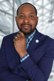 Andre Mathis in blue suit