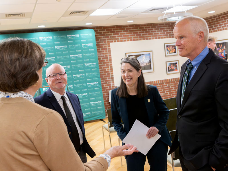 Anne, Harvey and Donald having a conversation.