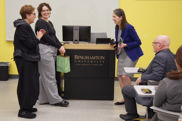 President Anne D'Alleva receives a gift from faculty and staff during the Listening to Lead Tour