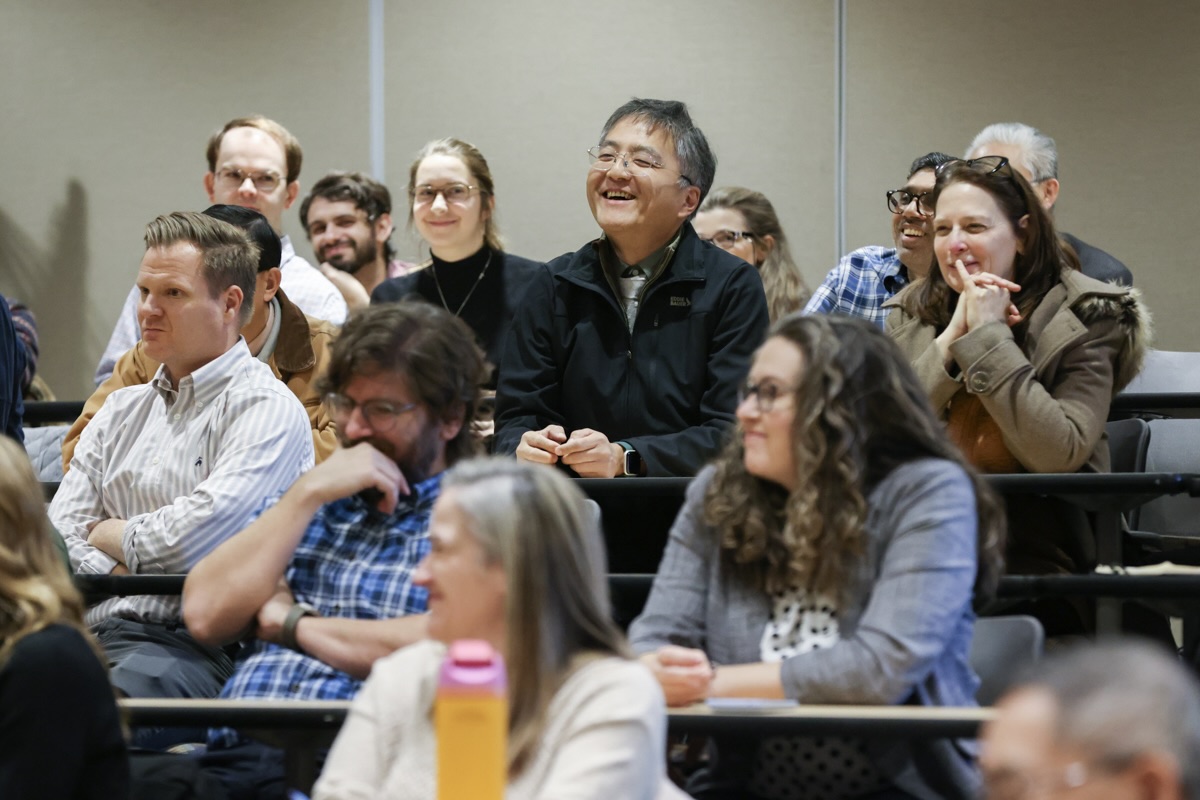 Faculty and staff from Watson College listen to President Anne D'Alleva