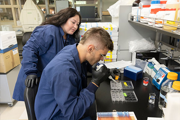 Photo of Andrew Waldon in David Werner's lab in Psychology