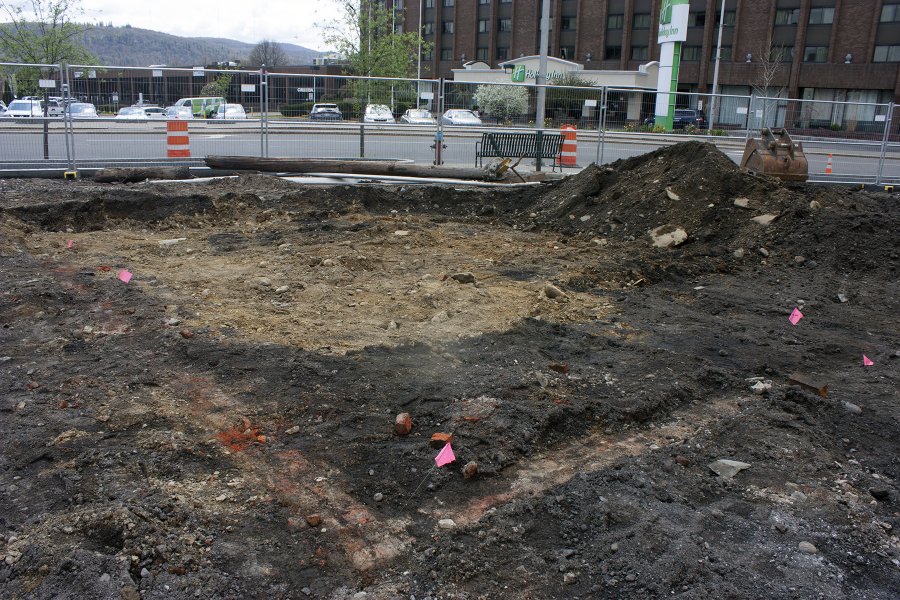 This brick foundation facing Hawley Street represents a rear addition to the home that once stood (the rest of the house was probably destroyed when Hawley was widened and curved in the 1960s). The house was built c. 1872 and used as a rental property until it was purchased by Fanny Beebee in 1889. 