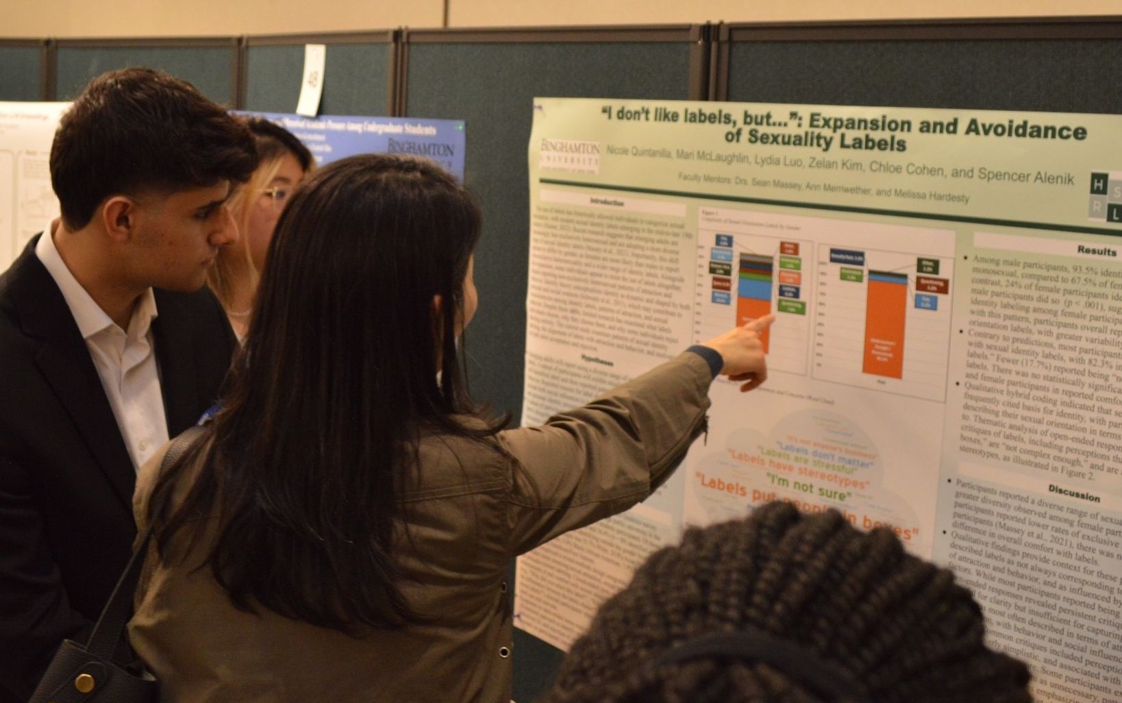 Pointing at research poster