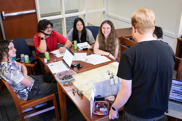 Students in Dickinson hall playing a board game.
