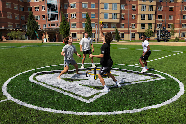 Students playing Spike Ball on the Newing Co-Rec field