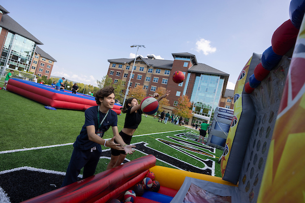 Students playing a basketball-style game during Autumn Bowl.