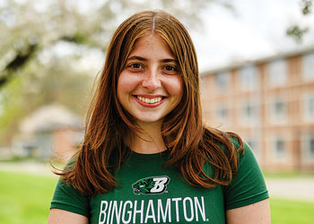 Binghamton University student smiling outdoors on campus.