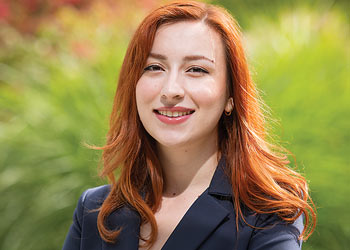 Binghamton University student smiling outdoors on campus.