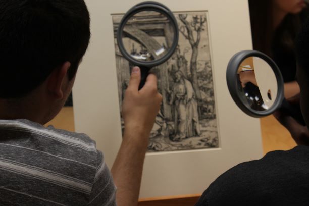 students examining artifacts photo