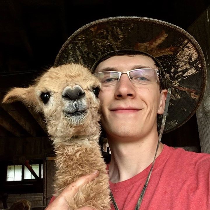 Dyllan May Poses with Baby Alpaca