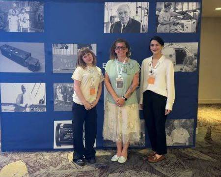 Photo of Beckman Scholars Nino Dzotsenidze (left) and Brikena Kukaj (right) and Mentor Dr. Tracy Brooks (center) at the Beckman Symposium